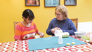 Old damsel instructing youthfull damsel to pump orb milk