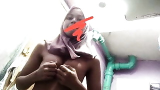 Azizah plays with her tits